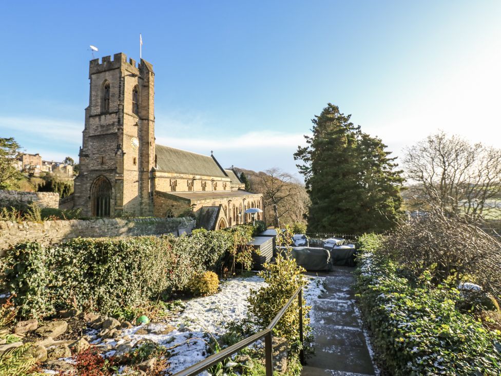An outdoor view of a church with a pathway and garden at 26 Frenchgate in Richmond