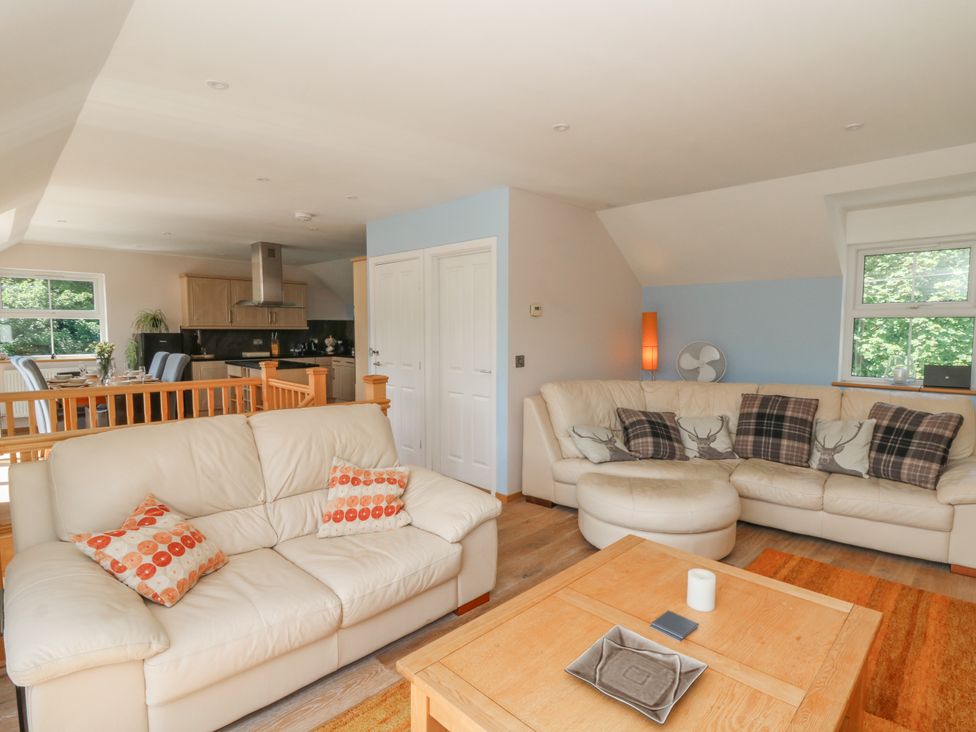 A living room with sofas and a coffee table at 1 Bryn Beudy in Stepaside