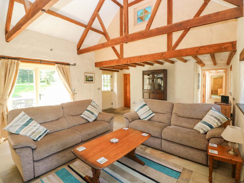 A living room with sofas and a coffee table at Carreg Las in Haverfordwest