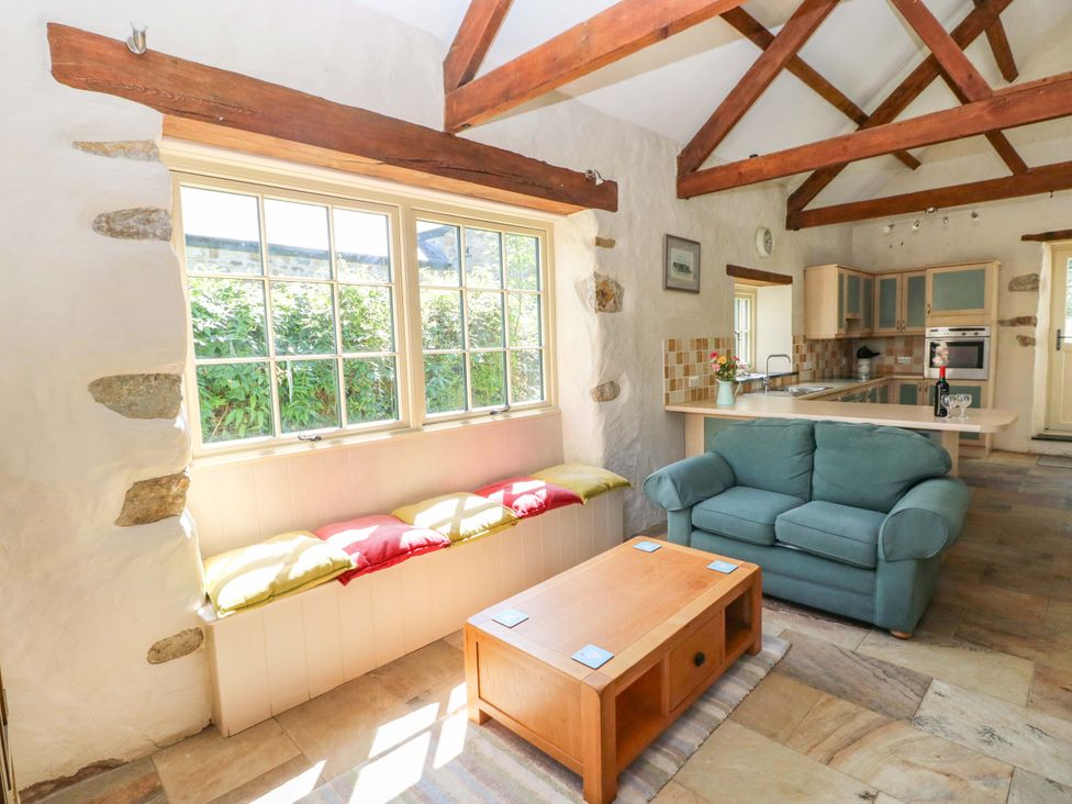 A living room with a sofa and coffee table at Carreg Las in Haverfordwest
