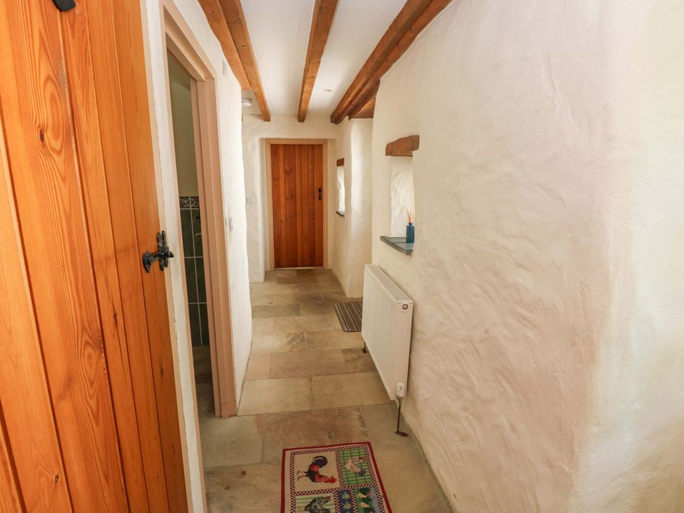 A hallway with doors and a radiator at Carreg Las in Haverfordwest