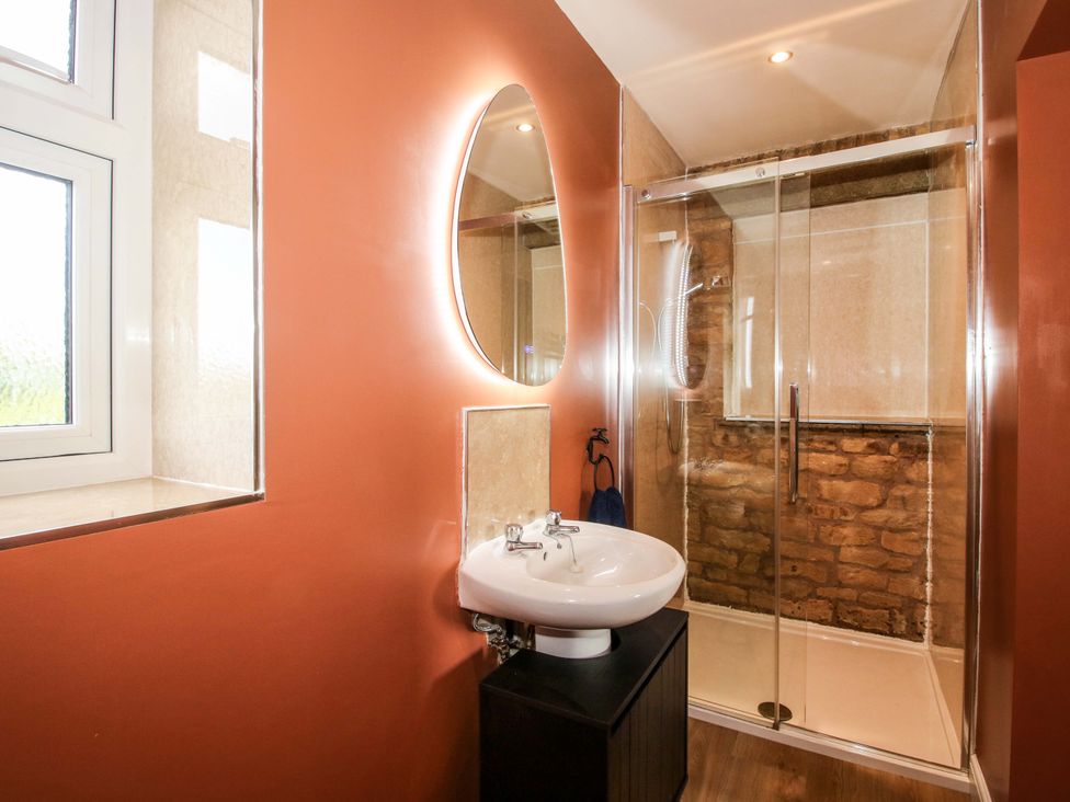A bathroom with a sink and shower at Dingle in Cleobury Mortimer