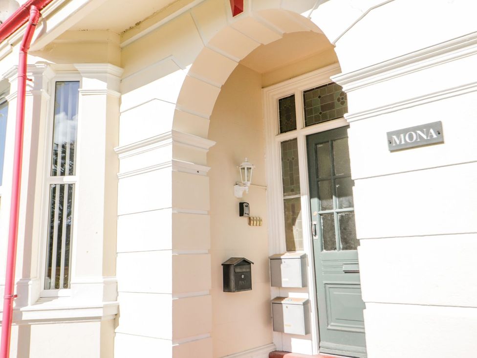 An entrance with a door and mailbox at Flat 1, Mona House in Conwy