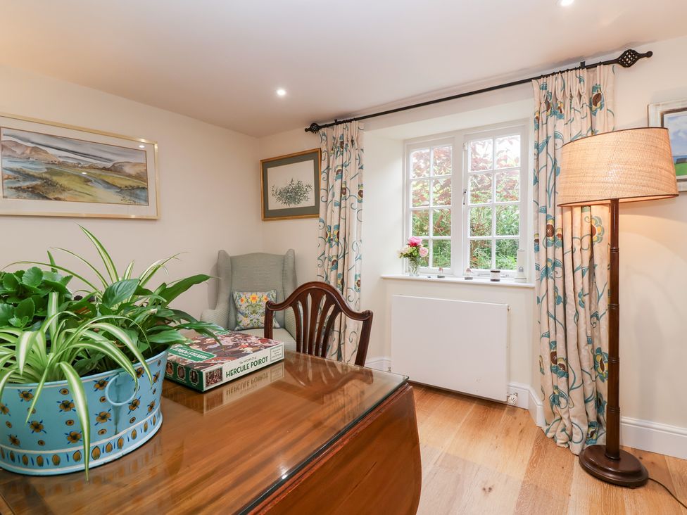 A study room with a desk and a window at Magdalen Cottage Hook Norton