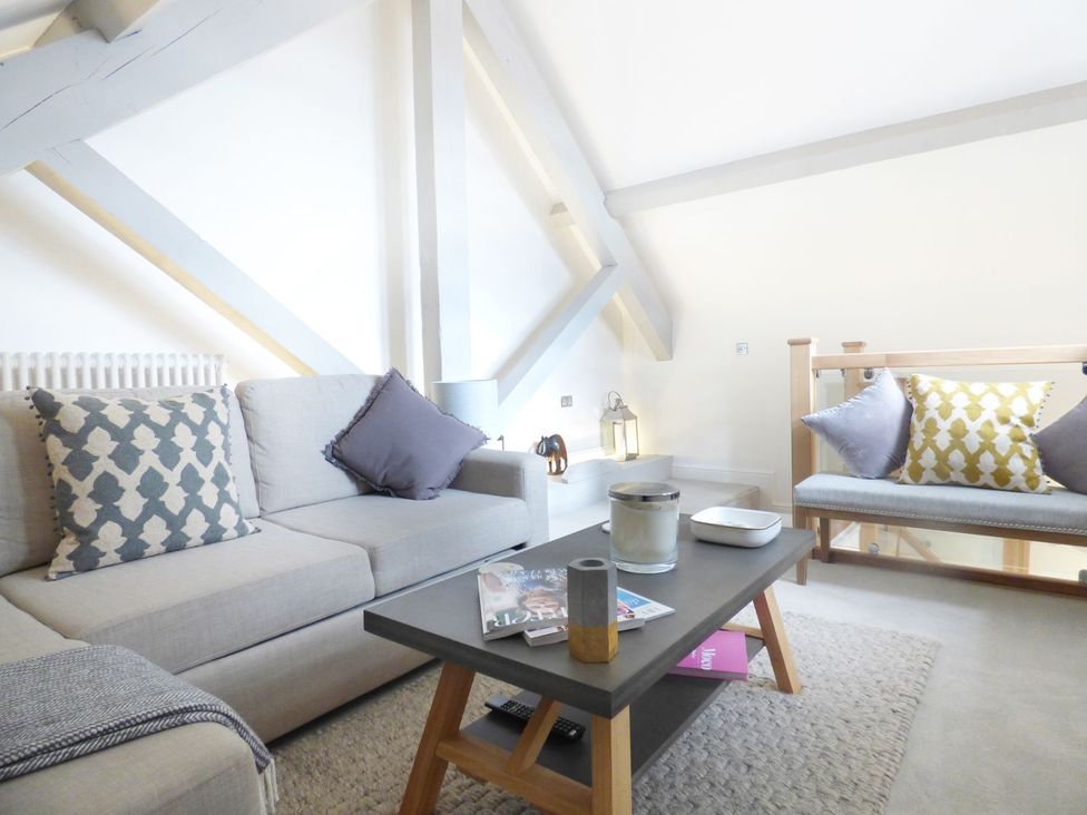 A living room with a sofa and coffee table at 1 Chapel Place Chester