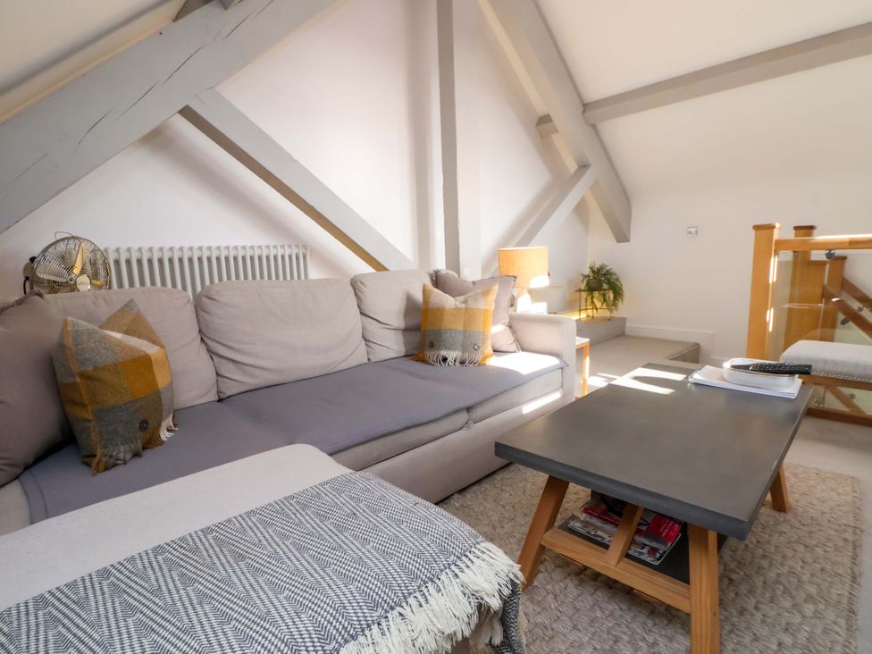 A living room with a sofa and coffee table at 1 Chapel Place Chester