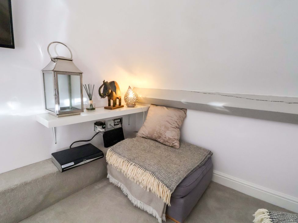 A snug area with a lantern and elephant figurine at 1 Chapel Place Chester