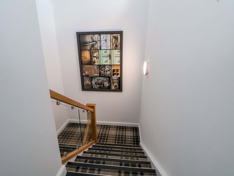 A stairway with a painting on the wall at 1 Chapel Place Chester