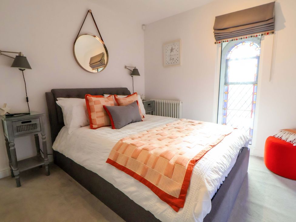 A bedroom with a bed and nightstand at 1 Chapel Place Chester