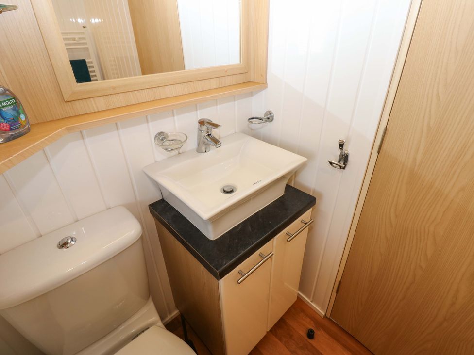 A bathroom with a sink and toilet at Plot 12 in Carlisle