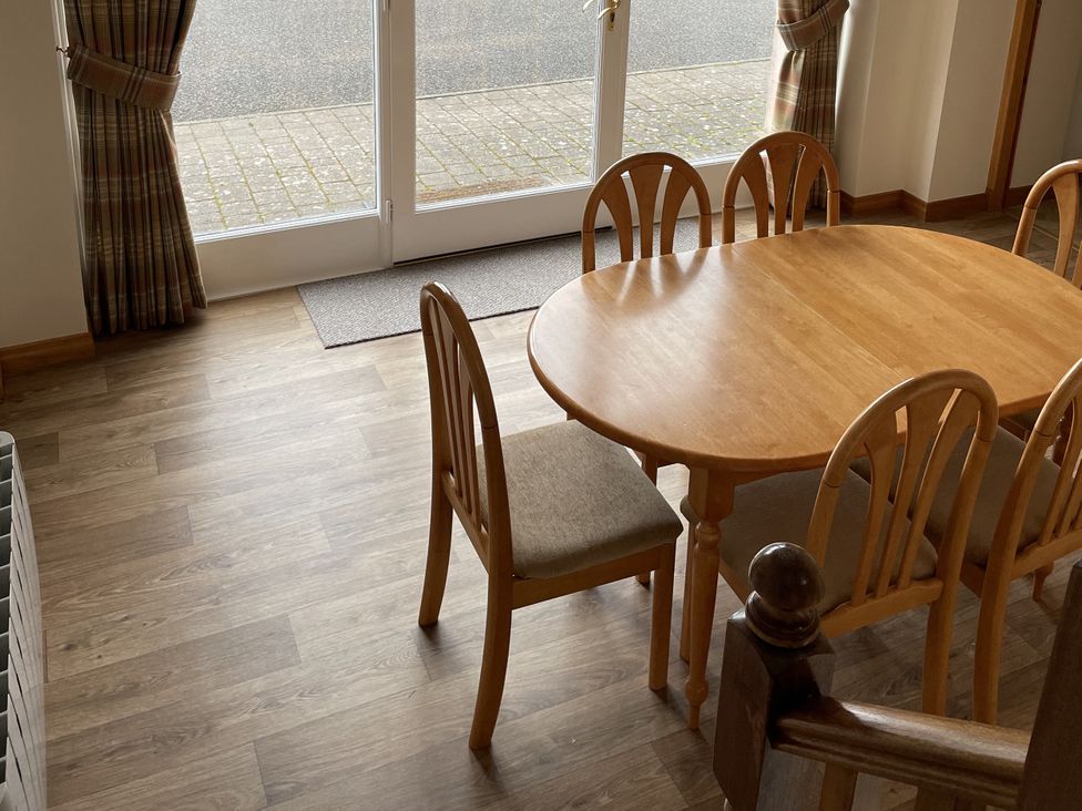 A dining room with a table and chairs at The ClockTower in Perth