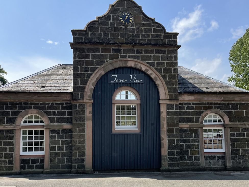 Building entrance with a clock and sign reading Tower View at The ClockTower in Perth