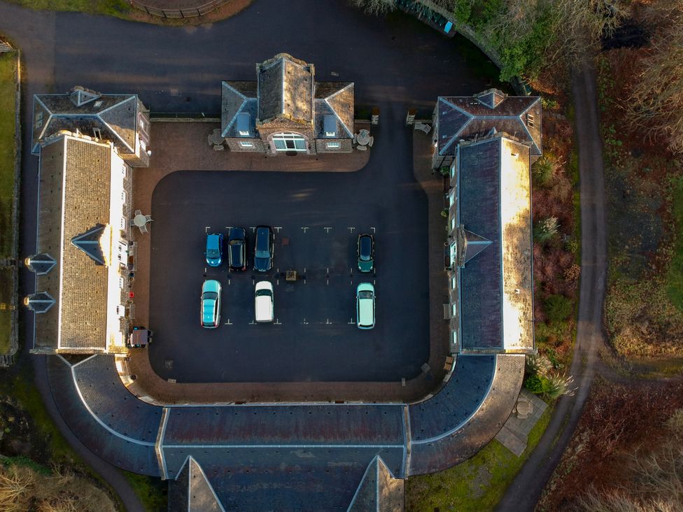 An aerial view of a parking lot with cars at Coach House 4 in Perth