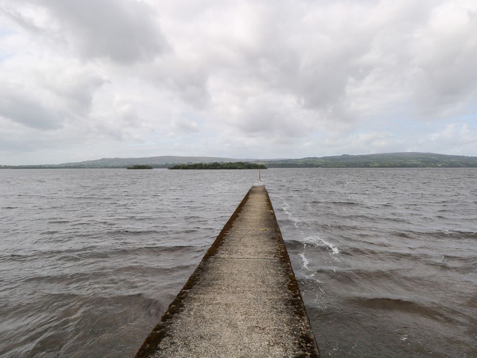 A pier extending over water at The Cottage in Ballinagleira