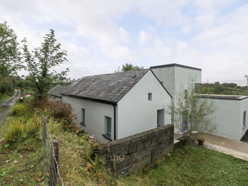 An outdoor view of a building and road at The Cottage in Ballinagleira
