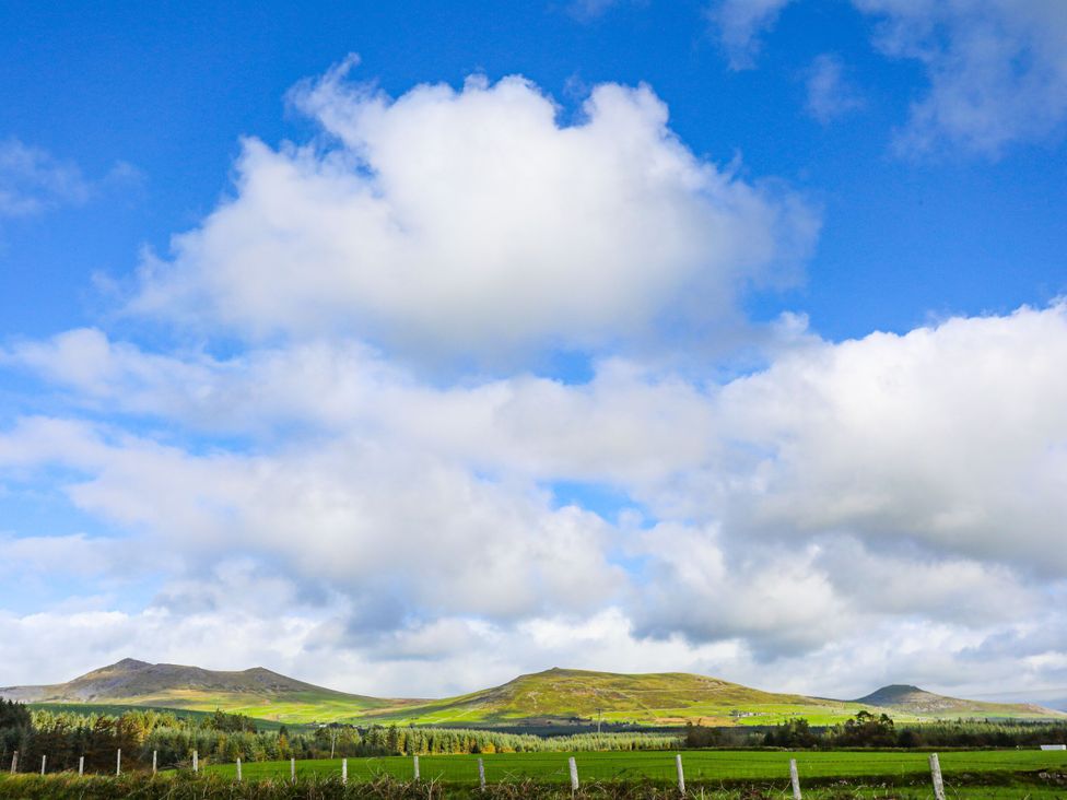 A landscape with mountains and clouds at Mountain View Haven/Hafan Y Mor near Pwllheli