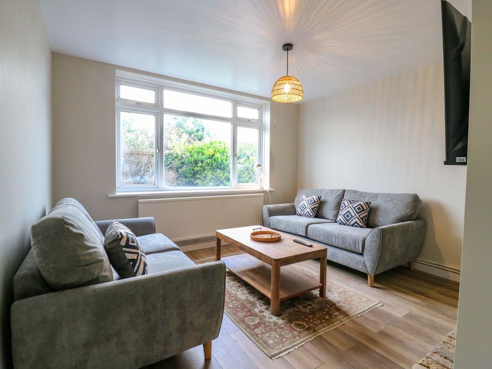 A living room with sofas and a coffee table at 13A Westgate Terrace in Whitstable