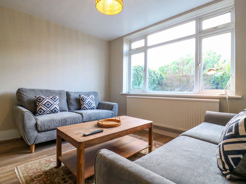A living room with two sofas and a coffee table at 13A Westgate Terrace Whitstable