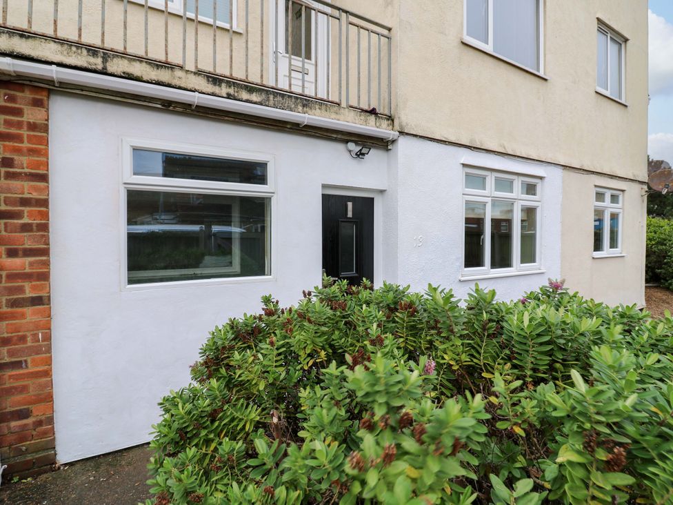A building facade with a front door and windows at High Tide in Whitstable