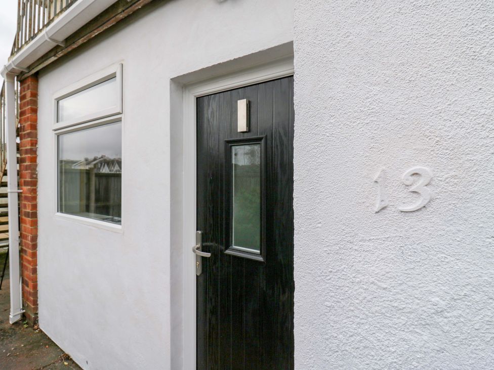 An entrance with a black door and window at High Tide in Whitstable