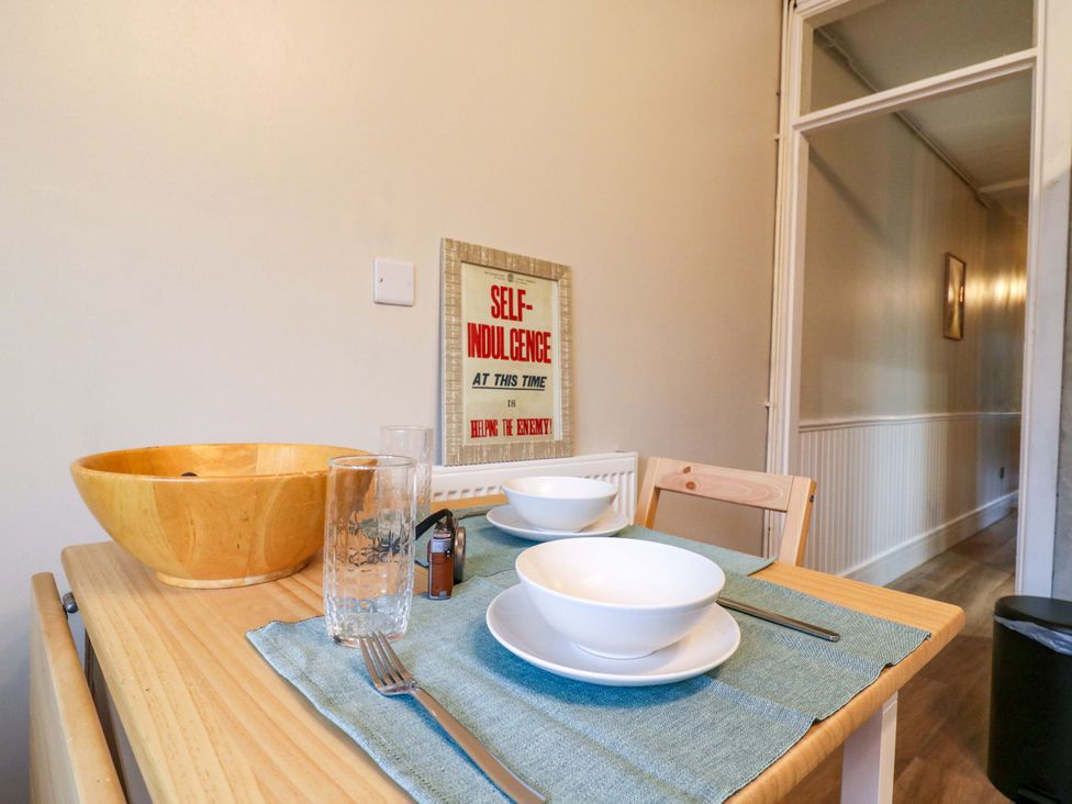 A dining room with a table set for two at High Tide in Whitstable