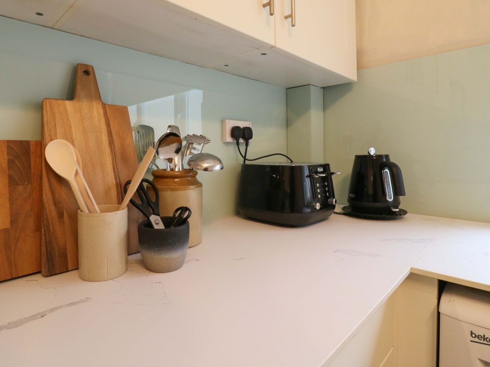 A kitchen counter with cooking utensils and appliances at High Tide in Whitstable