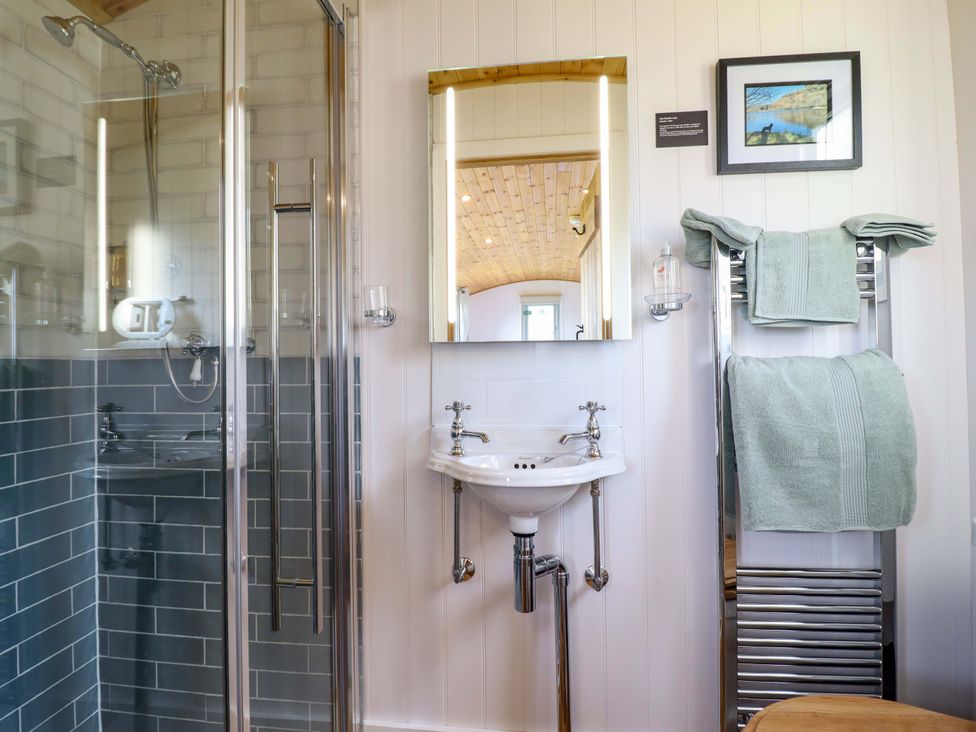 A bathroom with a shower and sink at Charollais in Oswestry