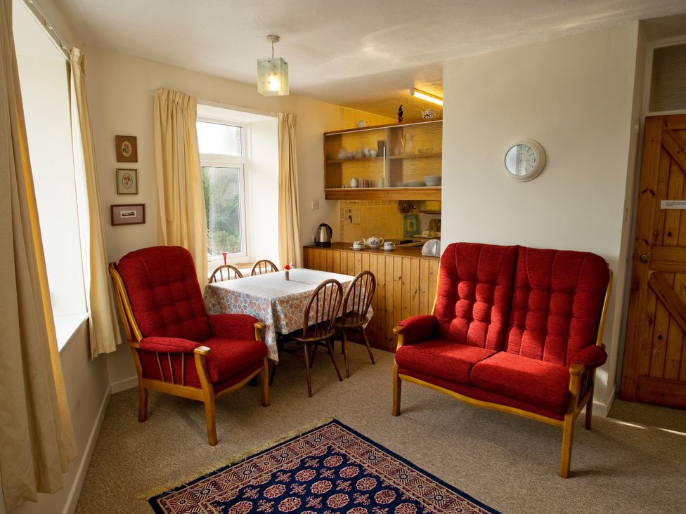 A dining room with a table and chairs at Chyancrowse in Gulval