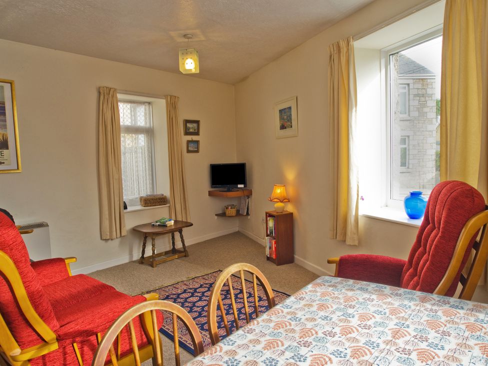 A living room with a sofa and table at Chyancrowse in Gulval