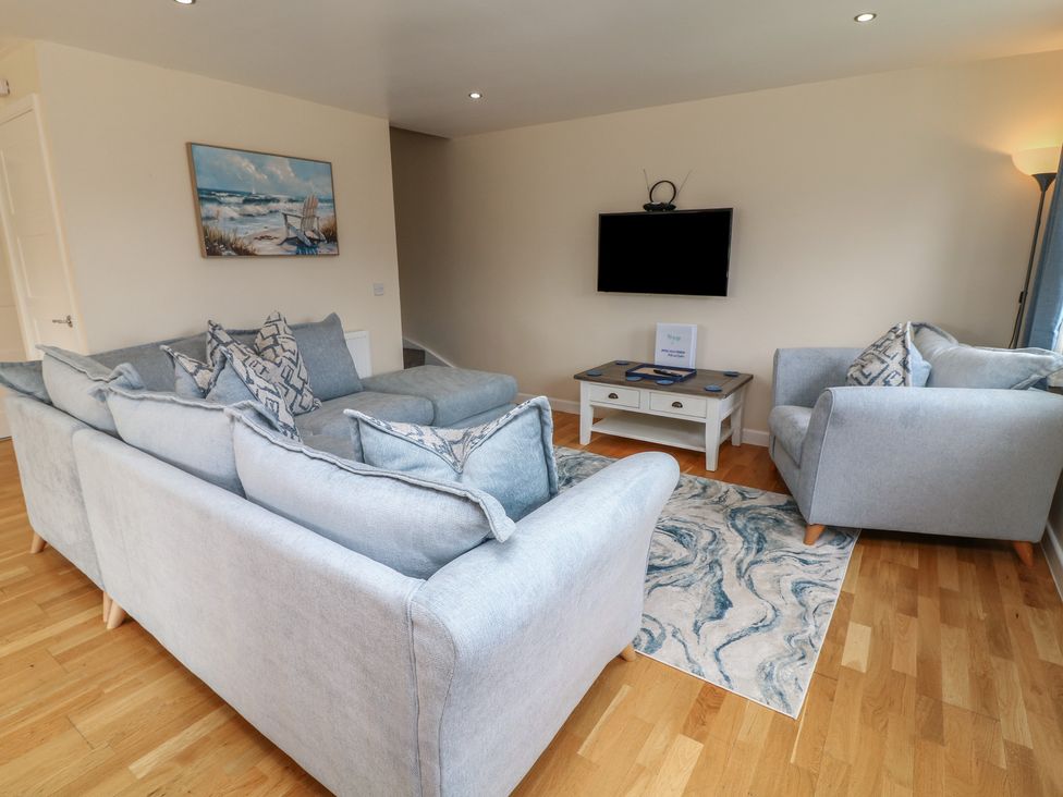 A living room with a sofa and coffee table at Lodge 21 in Brigg