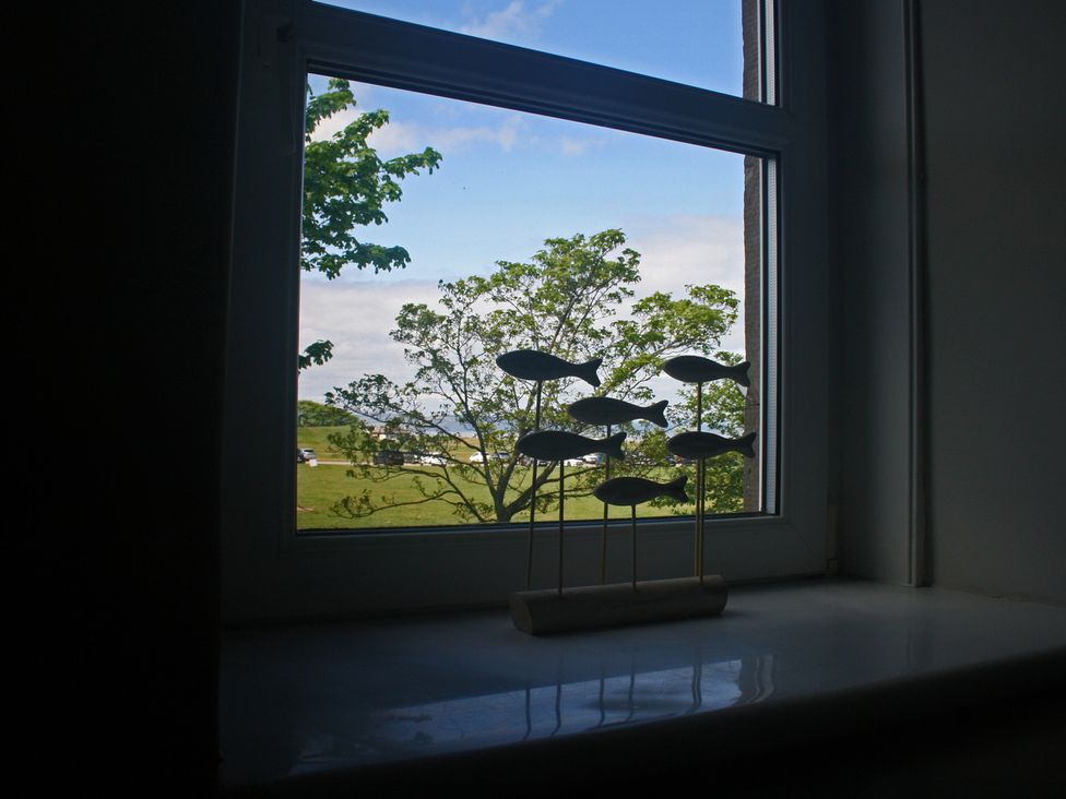 A window with a decorative object and view outside at 2 Links Place, Nairn