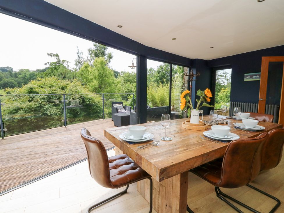 A dining room with a table and chairs at The Old Barn in Ciliau Aeron near Aberaeron