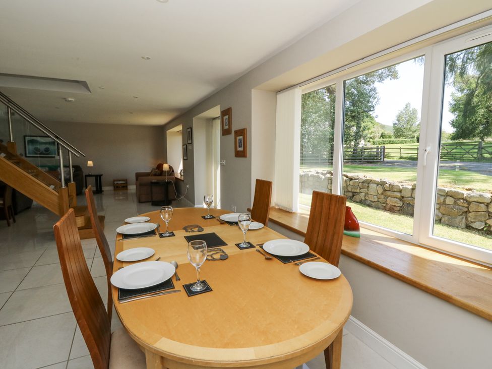 A dining room with a table and chairs at Little Penrhosgoch Barn in Llandrindod Wells