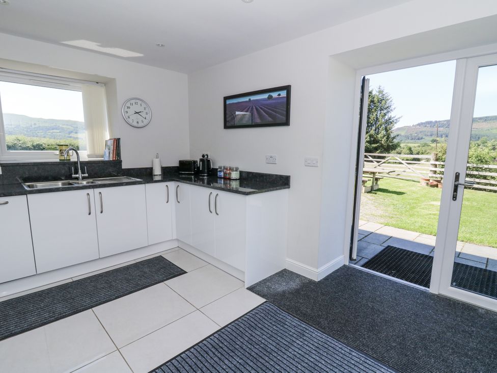 A kitchen with a sink and counter at Little Penrhosgoch Barn in Llandrindod Wells
