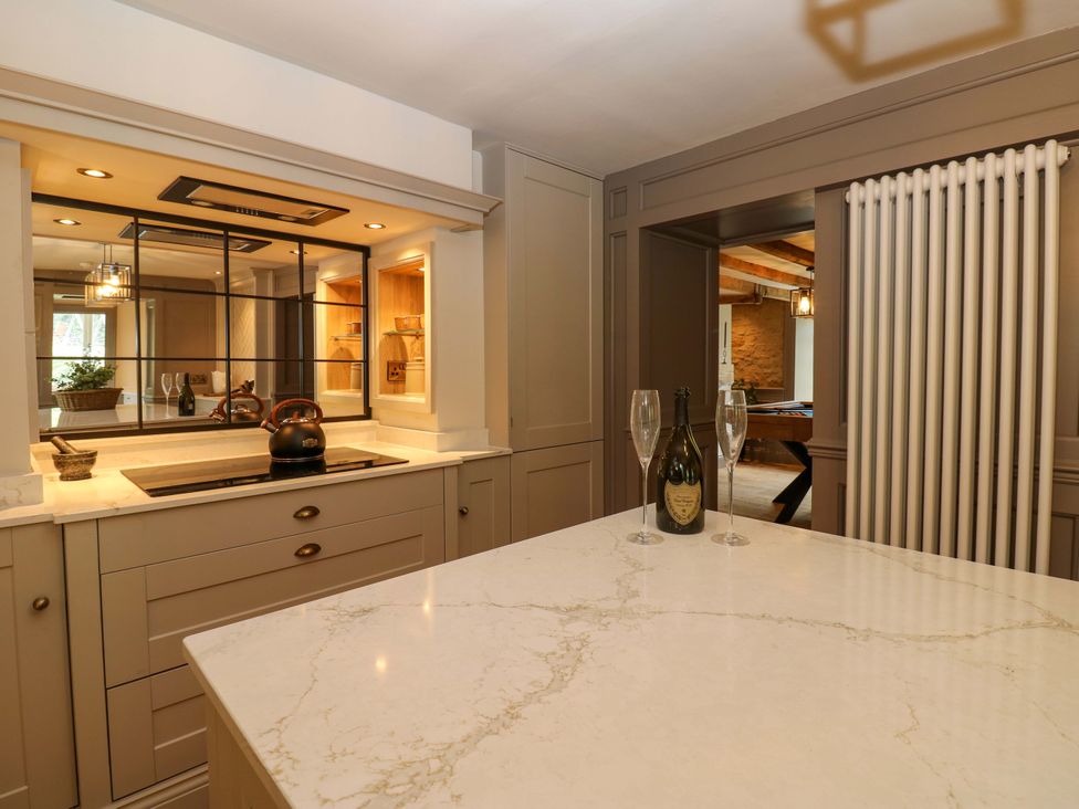 A kitchen with an island and kettle at White House in Durham