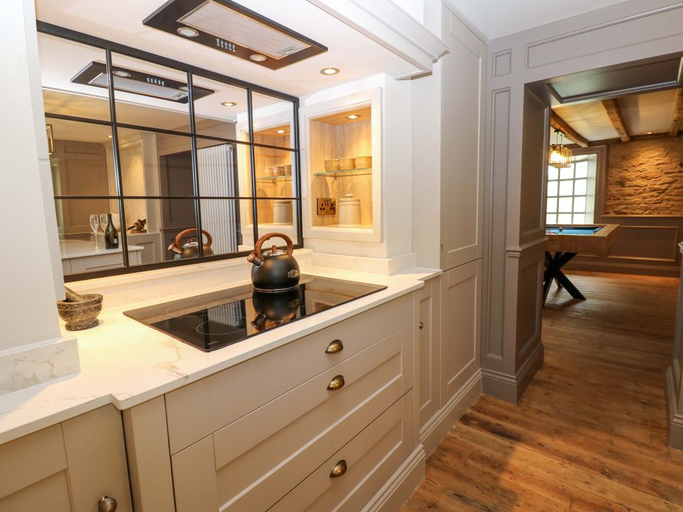 A kitchen featuring an induction cooktop and kettle at White House in Durham