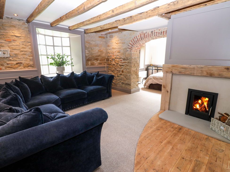 A living room with a sofa and fireplace at White House in Durham