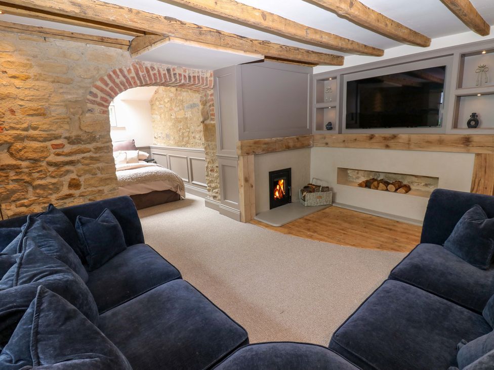 A living room with a sofa and fireplace at White House in Durham