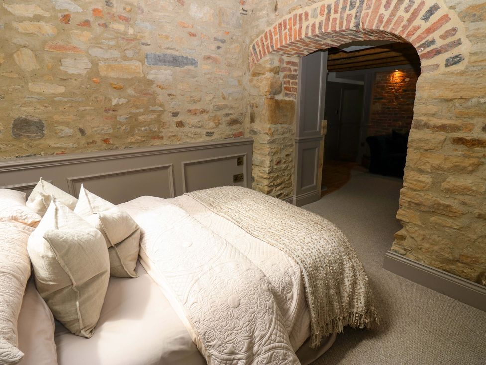 A bedroom with a bed and pillows at White House in Durham