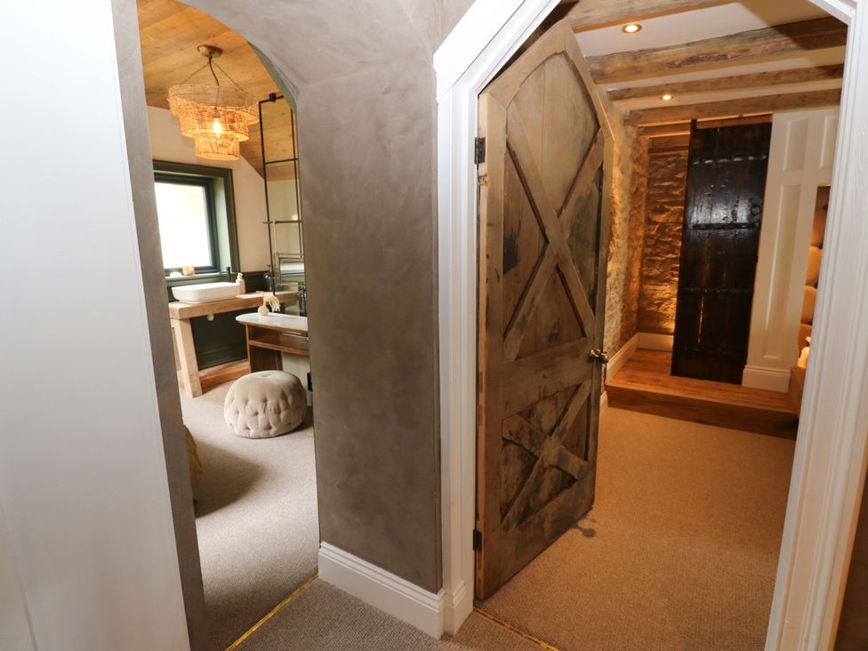 A bathroom with a sink and wooden counter at White House in Durham