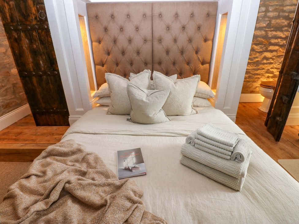 A bedroom with a bed and pillows at White House in Durham