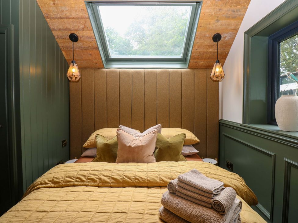 A bedroom with a bed and pillows at White House in Durham