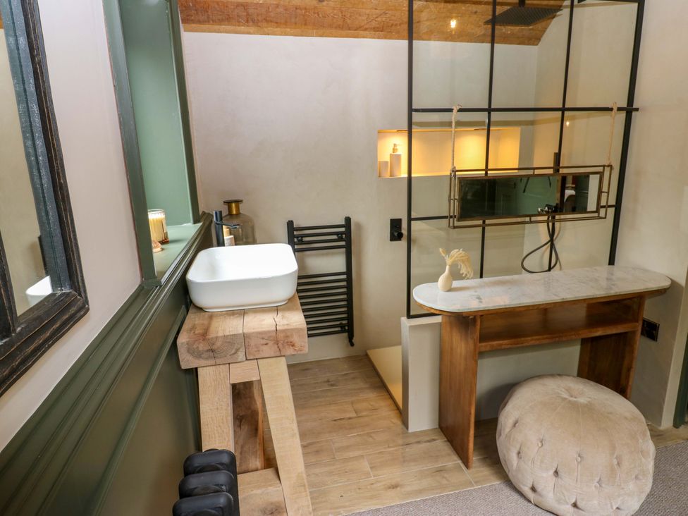A bathroom featuring a sink and mirror at White House in Durham