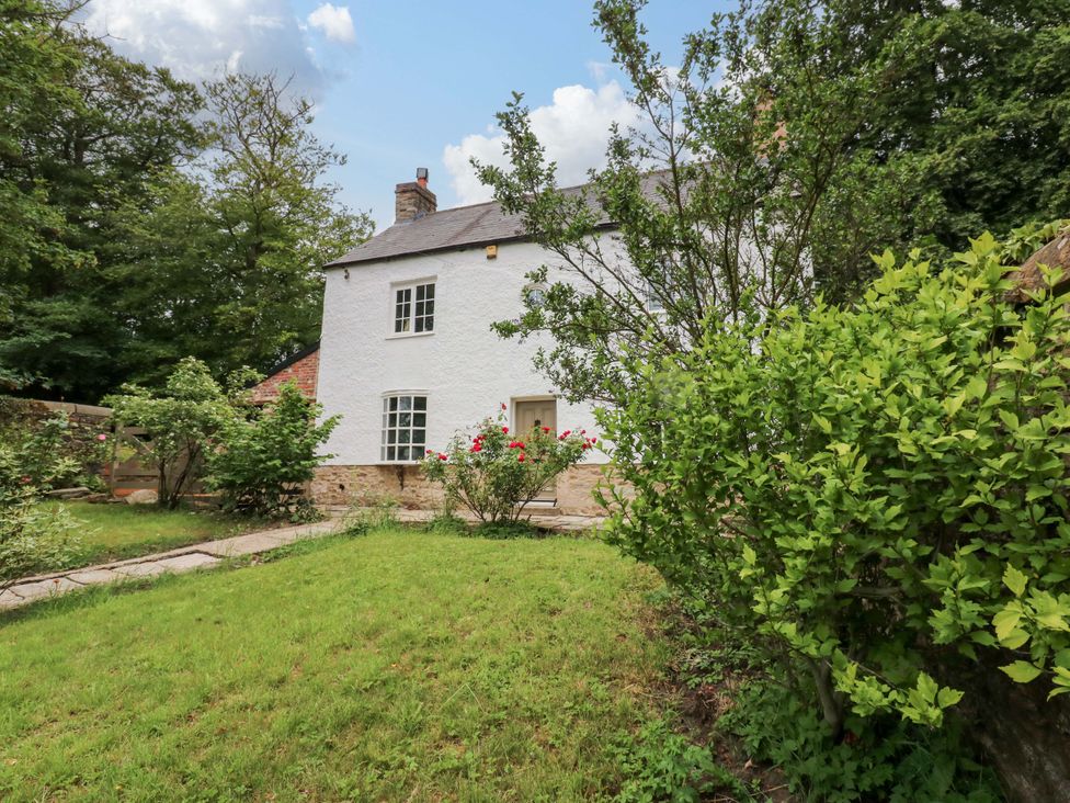 A house with a garden and pathway at White House in Durham