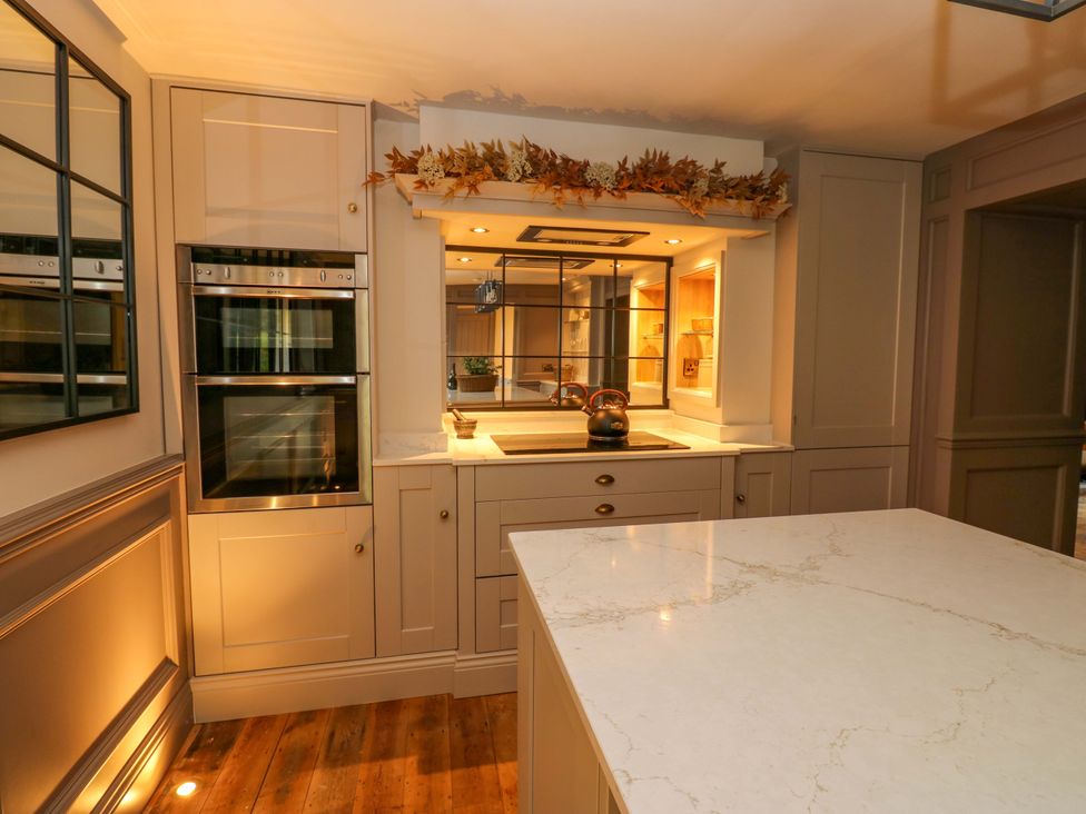 A kitchen with ovens and a kettle at White House in Durham