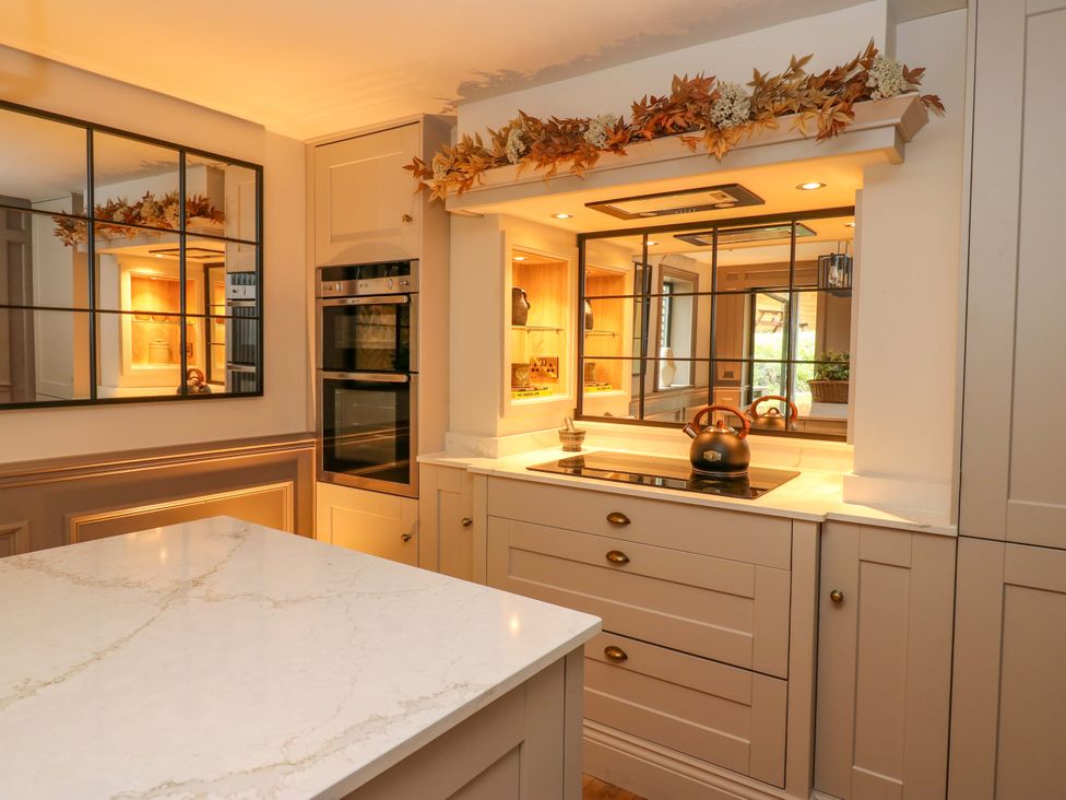 A kitchen with a stove and oven at White House in Durham
