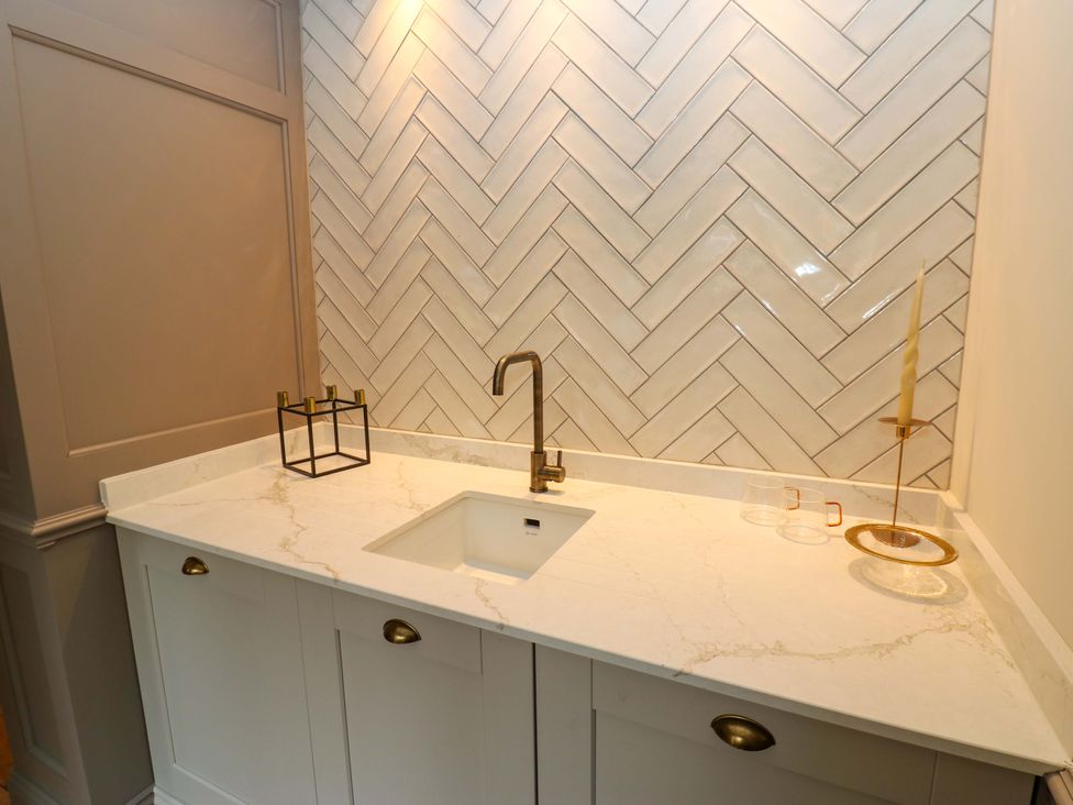 A kitchen with a sink and countertop at White House in Durham