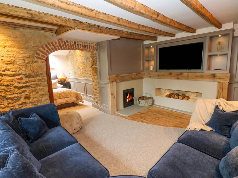 A snug with a sofa and fireplace at White House in Durham