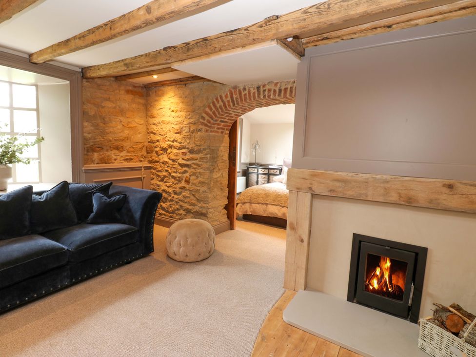 A living room with a sofa and fireplace at White House in Durham