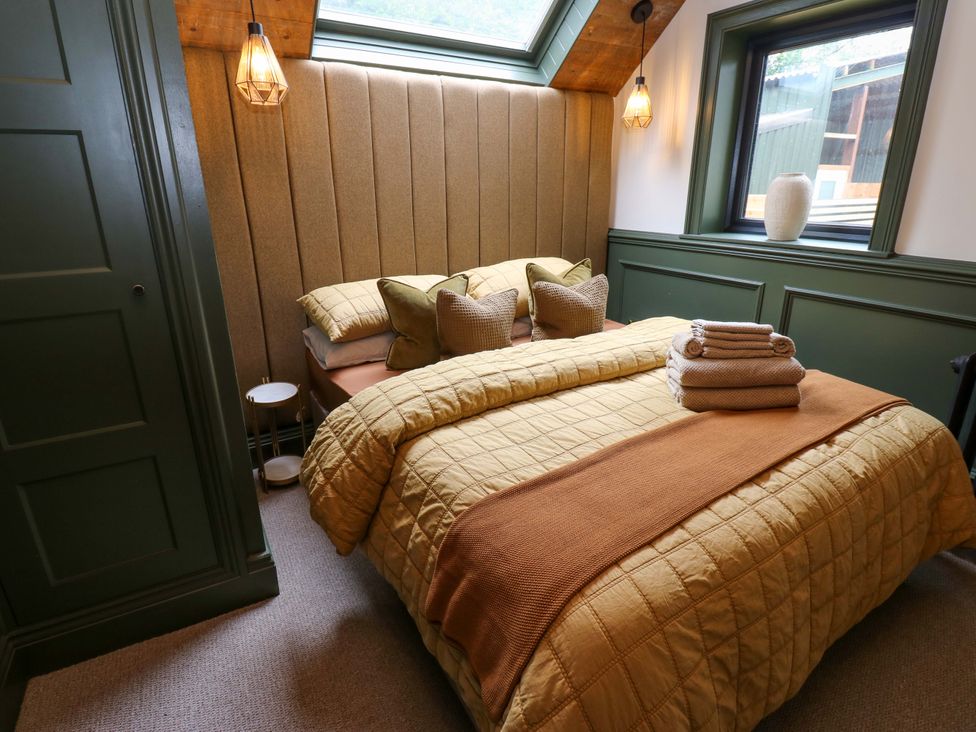 A bedroom with a bed and pillows at White House in Durham